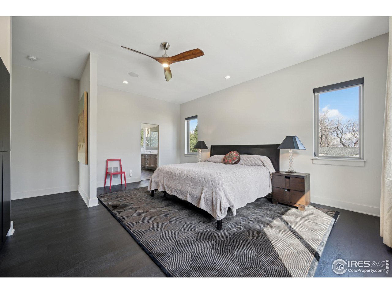 350 15th Street Boulder, CO 80302 - Photo 19 of 40 a bedroom with a bed and a ceiling fan