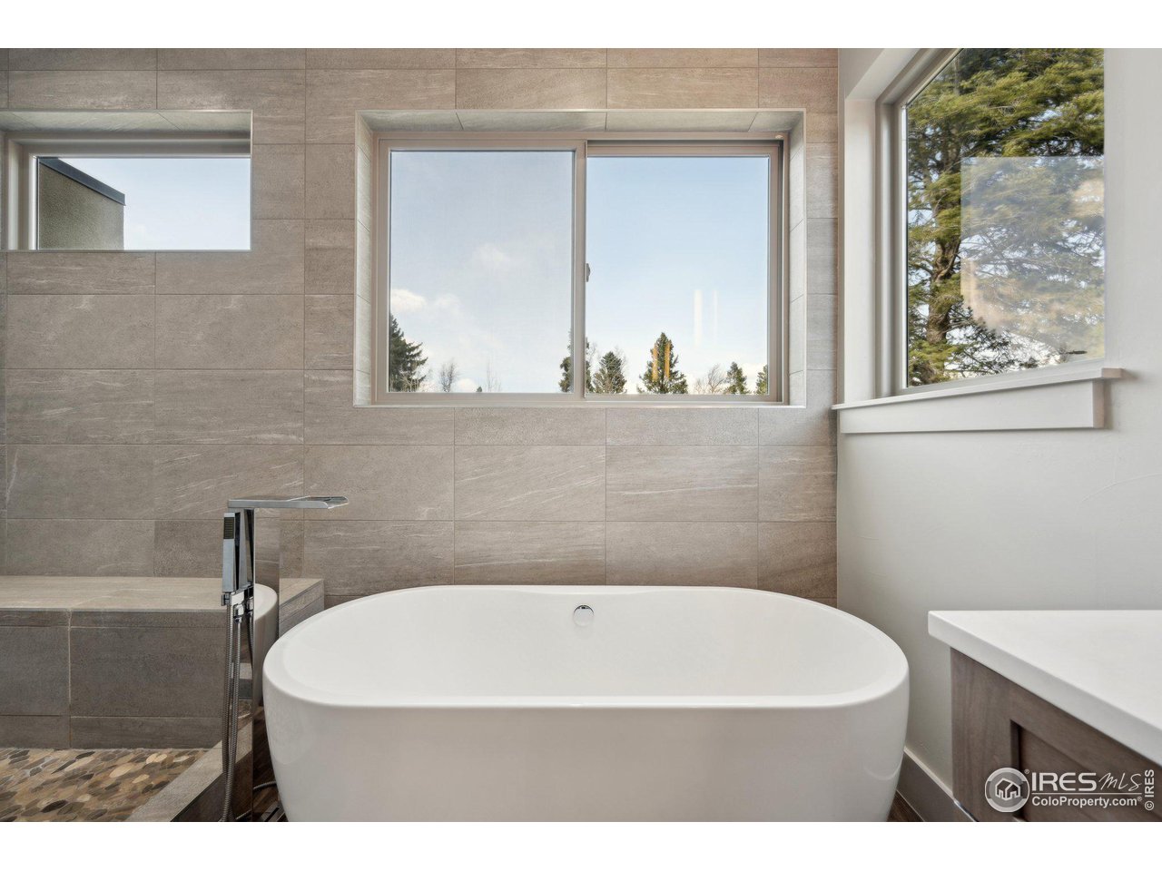350 15th Street Boulder, CO 80302 - Photo 22 of 40 a white bath tub sitting in a bathroom