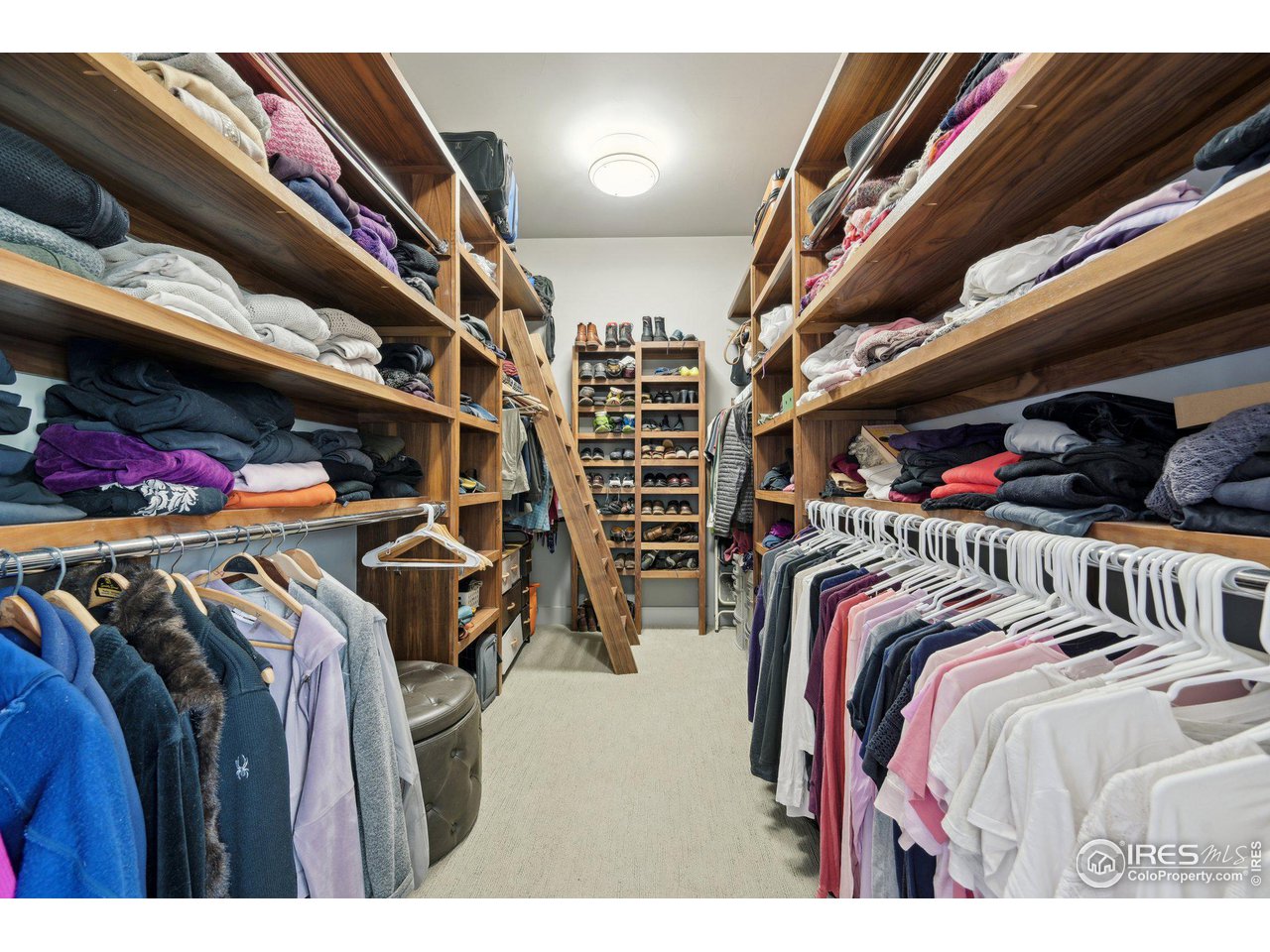 350 15th Street Boulder, CO 80302 - Photo 23 of 40 a view of walk in closet with clothes and shoes