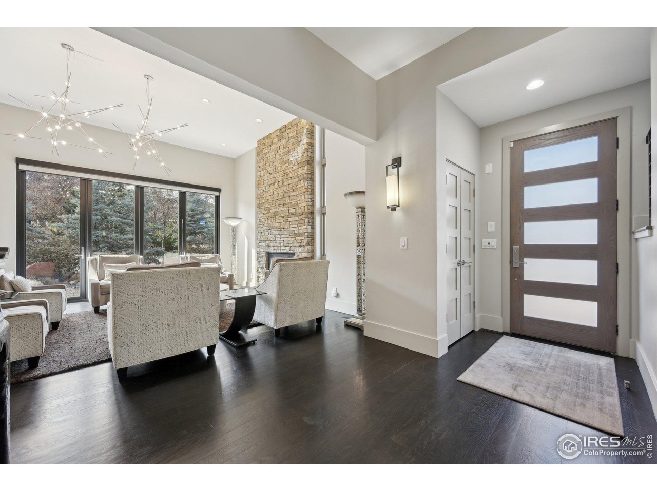 350 15th Street Boulder, CO 80302 - Photo 3 of 40 a living room with furniture and large windows