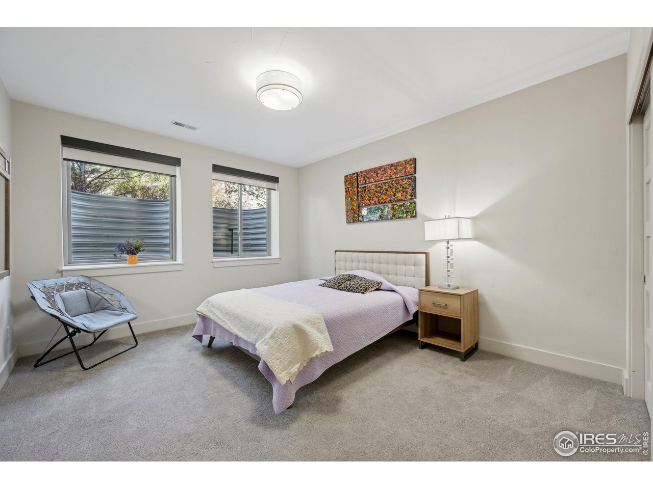 350 15th Street Boulder, CO 80302 - Photo 32 of 40 a bedroom with a bed and a window