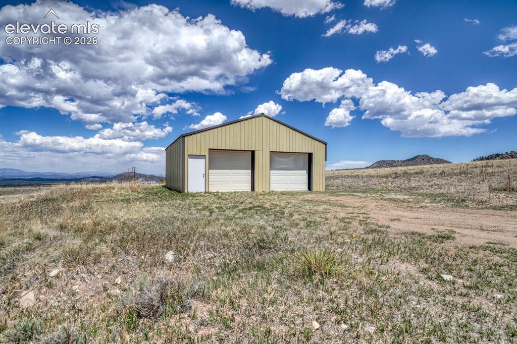 489 Excelsior Road Westcliffe, CO 81252 - Photo 29 of 34 a view of a house with a yard