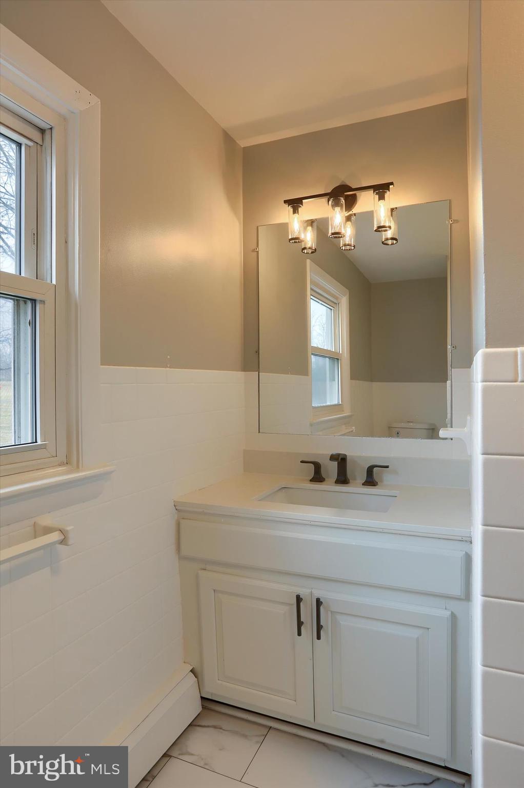 685 Knight Road Harrisburg, PA 17111 - Photo 32 of 47 a bathroom with a sink and a mirror