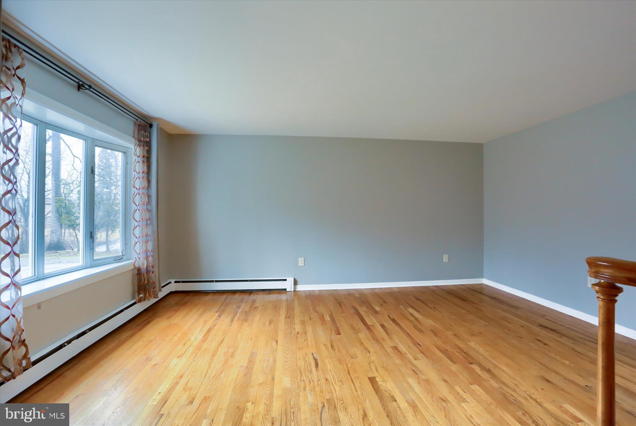 685 Knight Road Harrisburg, PA 17111 - Photo 6 of 47 a view of empty room with wooden floor and fan