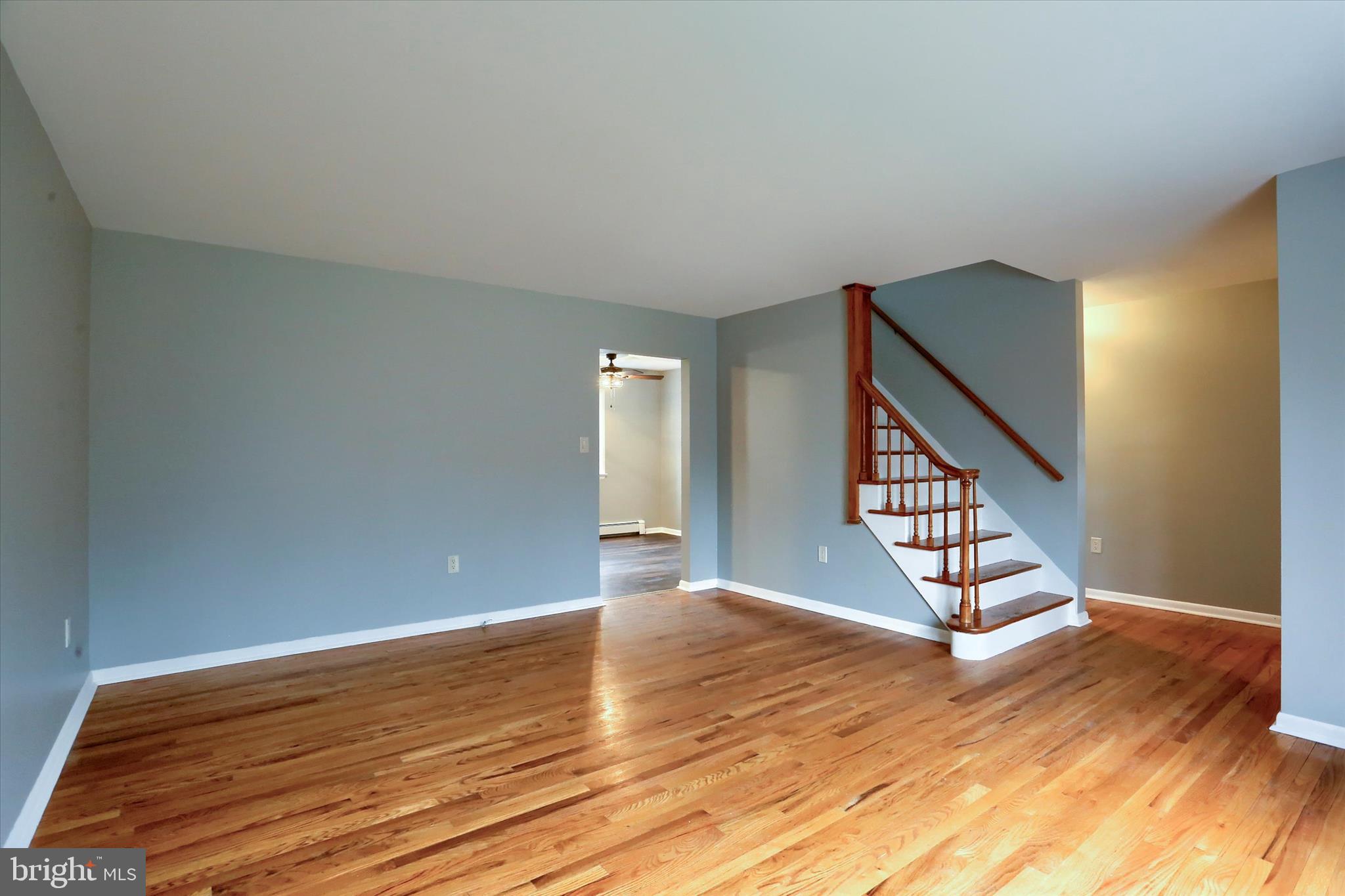 685 Knight Road Harrisburg, PA 17111 - Photo 7 of 47 a view of an empty room with wooden floor and stairs