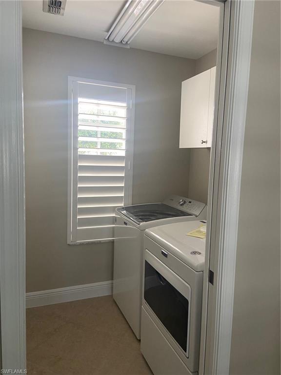 22171 Seashore Circle Estero, FL 33928 - Photo 13 of 16 a utility room with dryer and washer