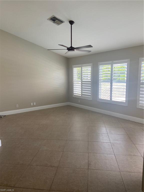 22171 Seashore Circle Estero, FL 33928 - Photo 6 of 16 a view of an empty room with a window