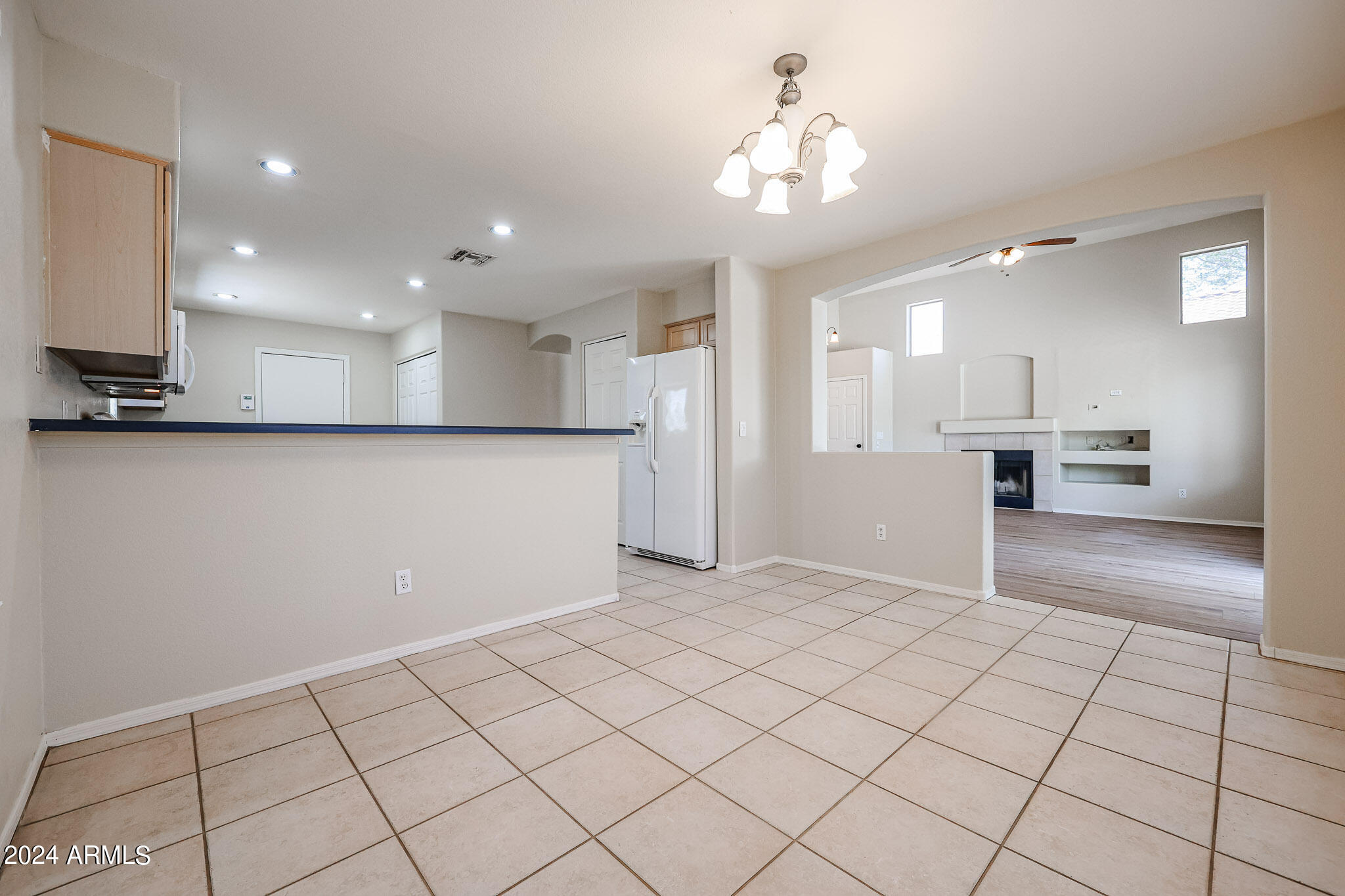 6921 West Juniper Avenue Peoria, AZ 85382 - Photo 16 of 33 a view of an empty room and kitchen view