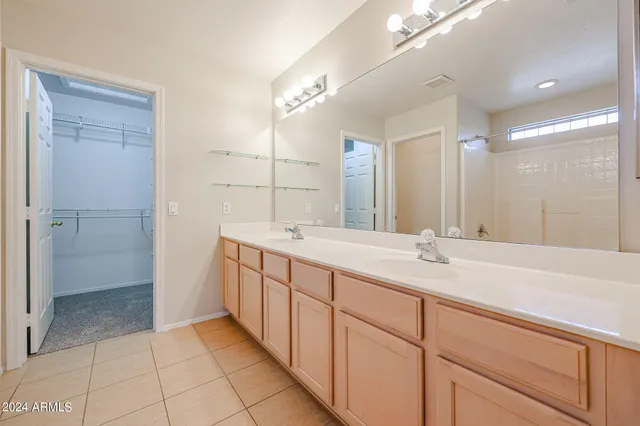 a bathroom with a granite countertop sink mirror and