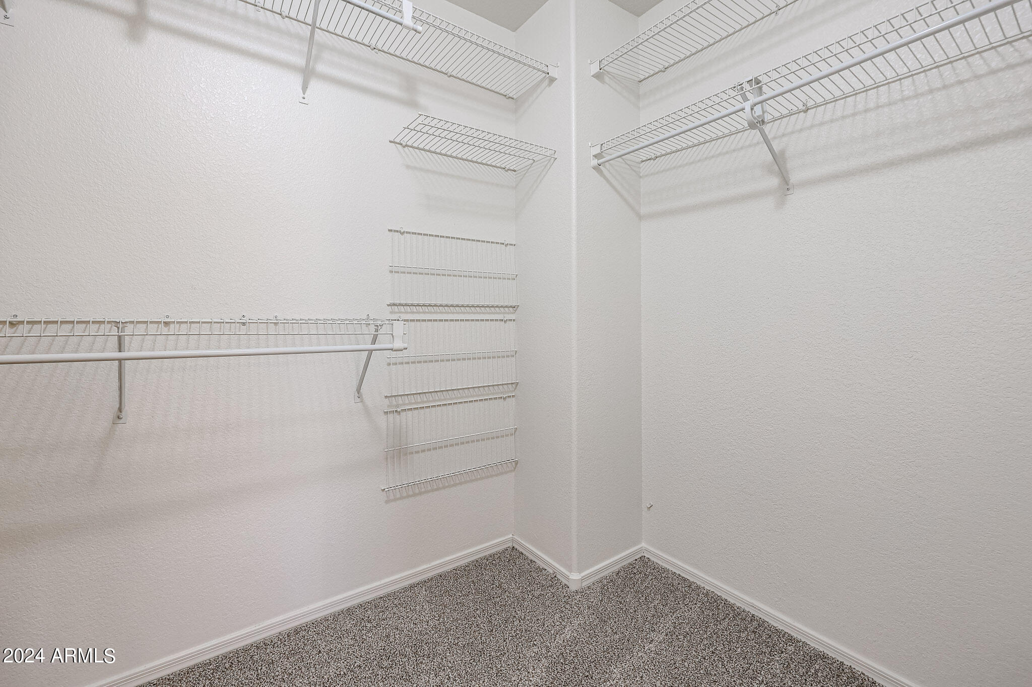 6921 West Juniper Avenue Peoria, AZ 85382 - Photo 24 of 33 a view of a room with racks on the wall