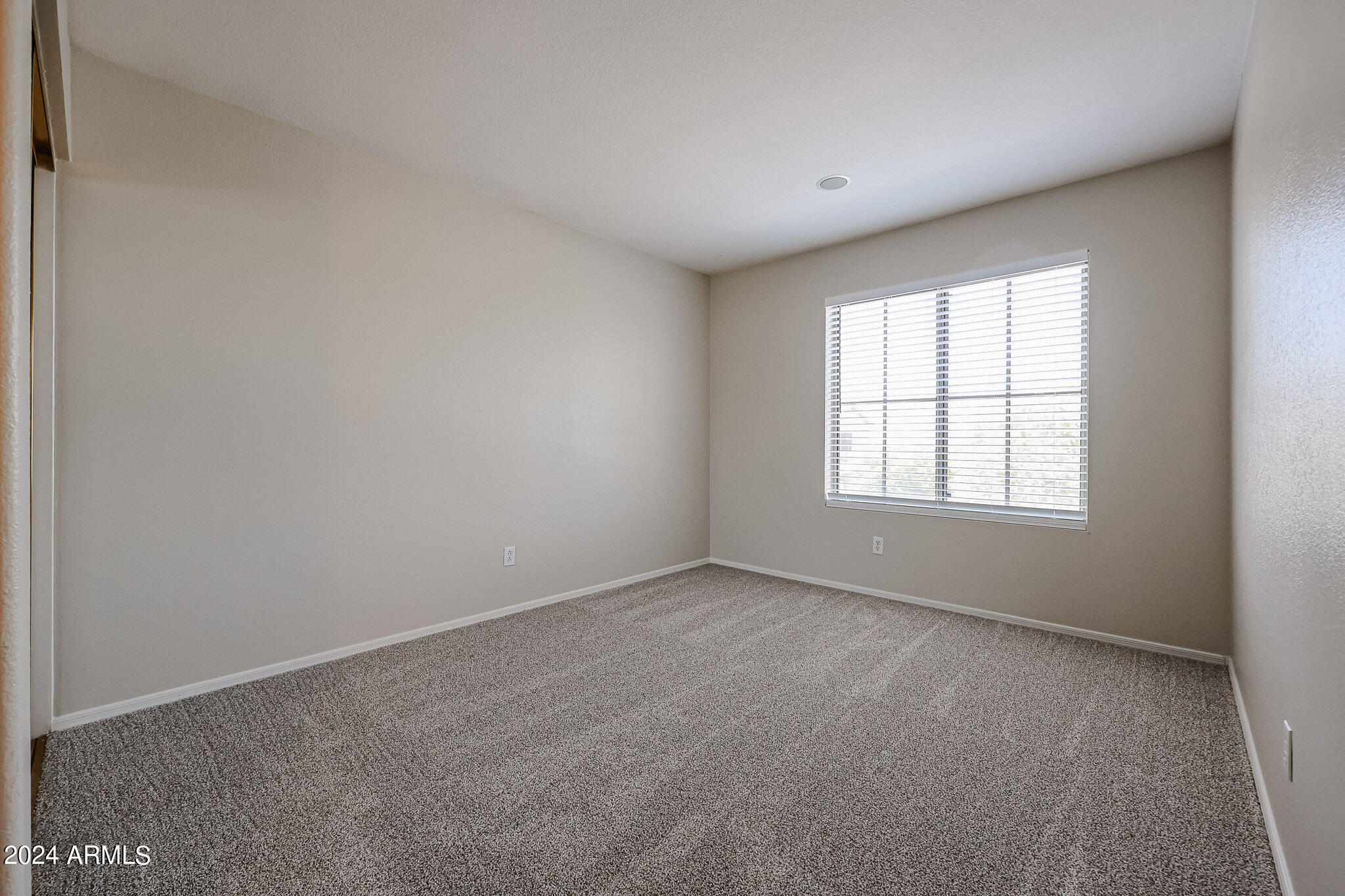 6921 West Juniper Avenue Peoria, AZ 85382 - Photo 25 of 33 an empty room with windows
