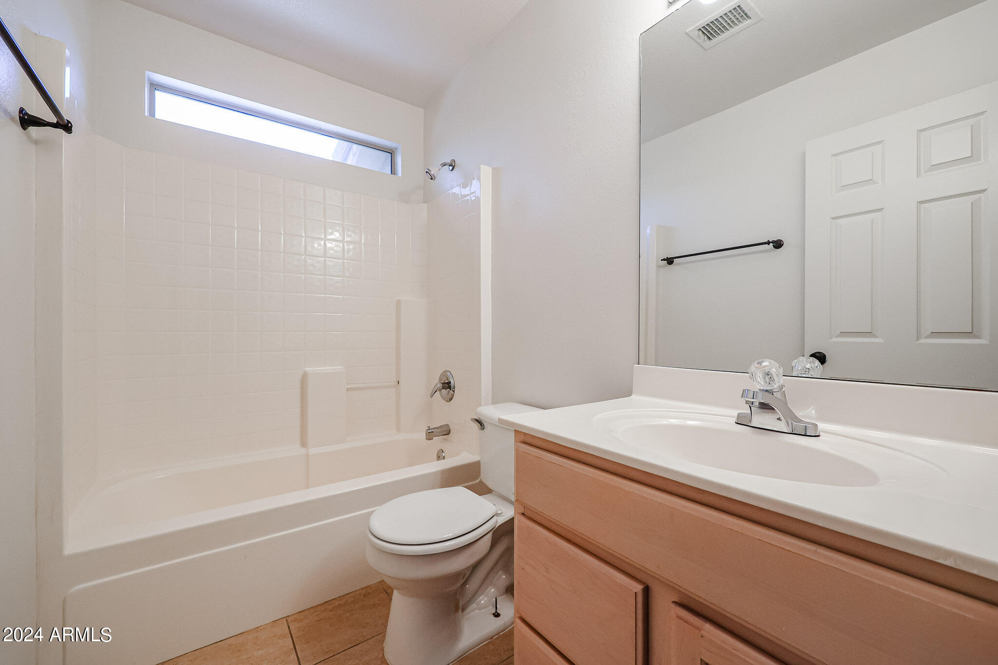 6921 West Juniper Avenue Peoria, AZ 85382 - Photo 27 of 33 a bathroom with a sink a toilet and shower