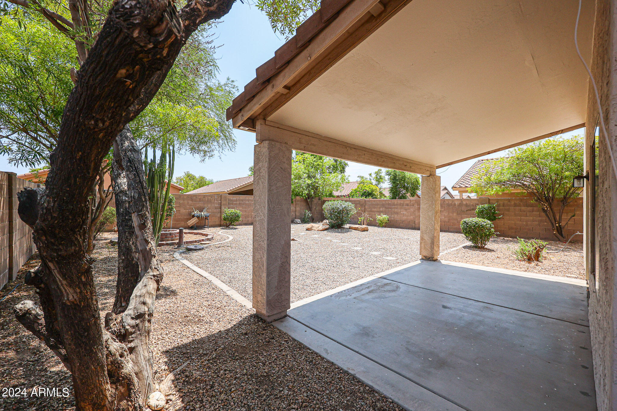6921 West Juniper Avenue Peoria, AZ 85382 - Photo 31 of 33 a view of a room with wooden floor and a large tree