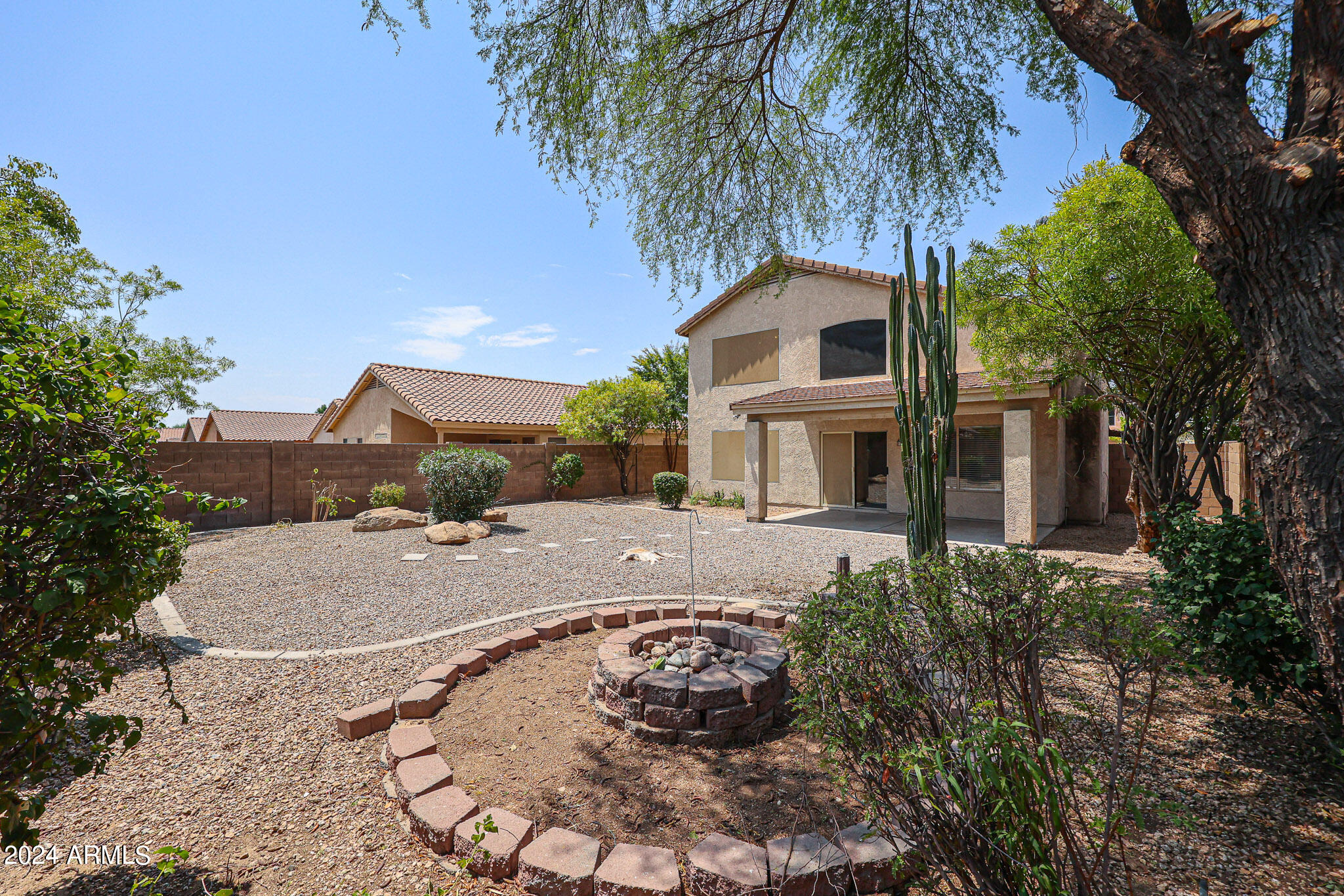 6921 West Juniper Avenue Peoria, AZ 85382 - Photo 32 of 33 a front view of a house with a yard