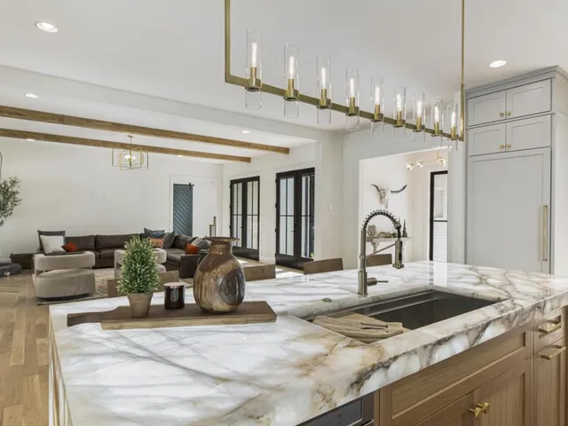 a view of a dining room with furniture large windows and wooden floor