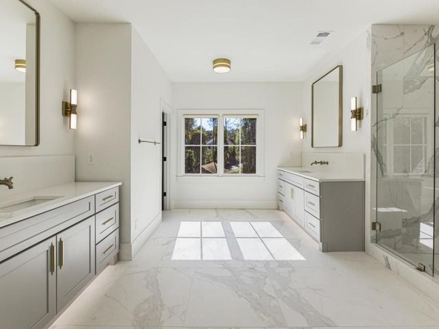 a white bath tub sitting in a bathroom