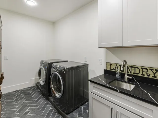 a bedroom with a bed and a tv