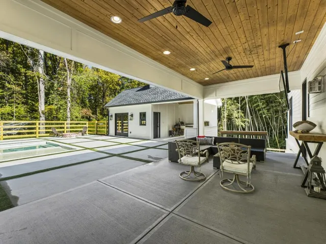 a kitchen with a stove a sink and a microwave