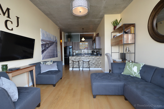 235 West Van Buren Street, Unit 3311 Chicago, IL 60607 - Photo 8 of 23 a living room with furniture and a flat screen tv