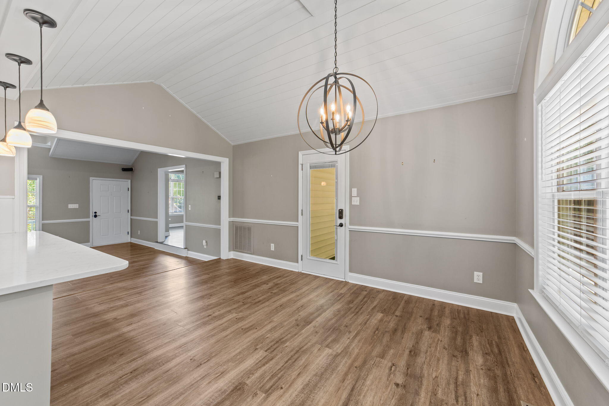 6820 Oviedo Drive Raleigh, NC 27603 - Photo 14 of 50 a view of empty room with wooden floor and window