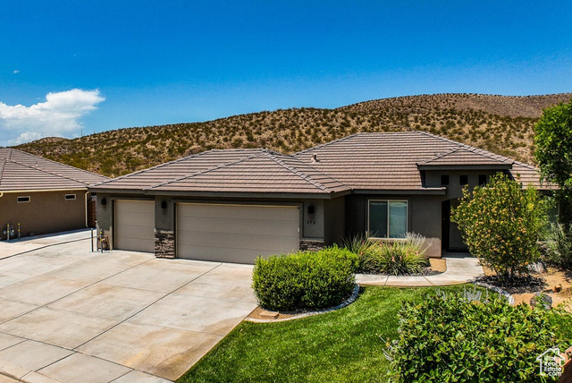 979 North 300 West Hurricane, UT 84737 - Photo 1 of 1 View of front of property with a garage and a mountain view
