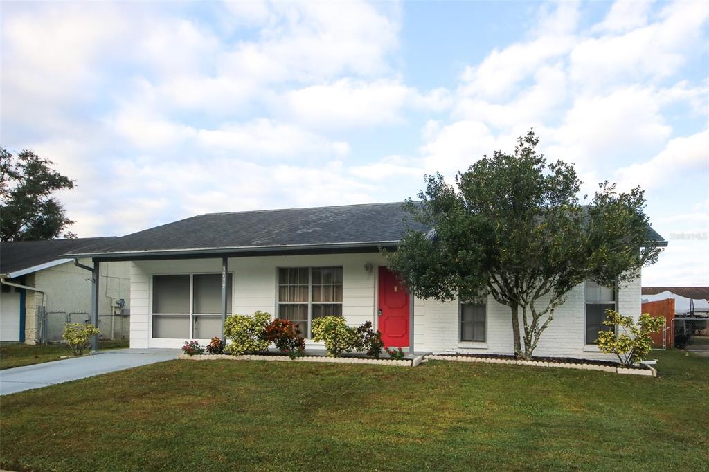 3739 Modesto Street New Port Richey, FL 34655 - Photo 1 of 1 a front view of a house with a garden
