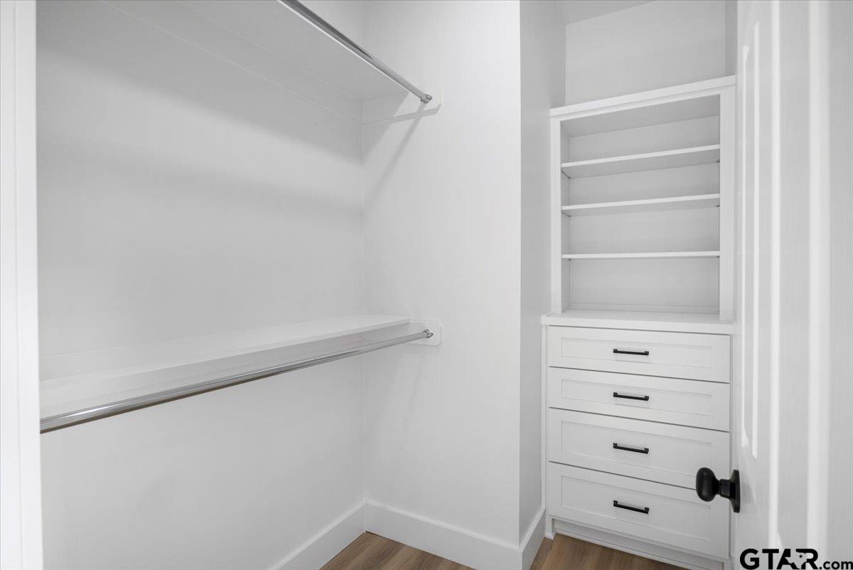 6600 Lionheart Drive Tyler, TX 75708 - Photo 18 of 32 a view of walk in closet with empty racks