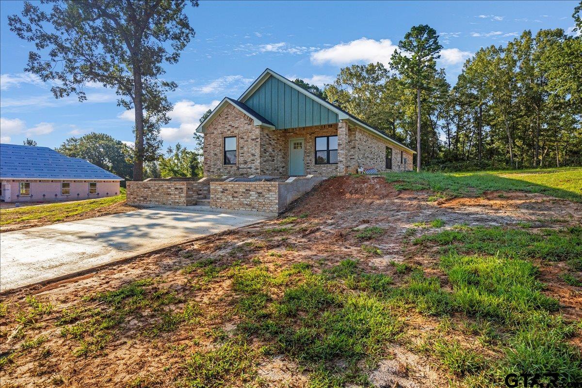 6600 Lionheart Drive Tyler, TX 75708 - Photo 2 of 32 a view of a house with a yard and large tree