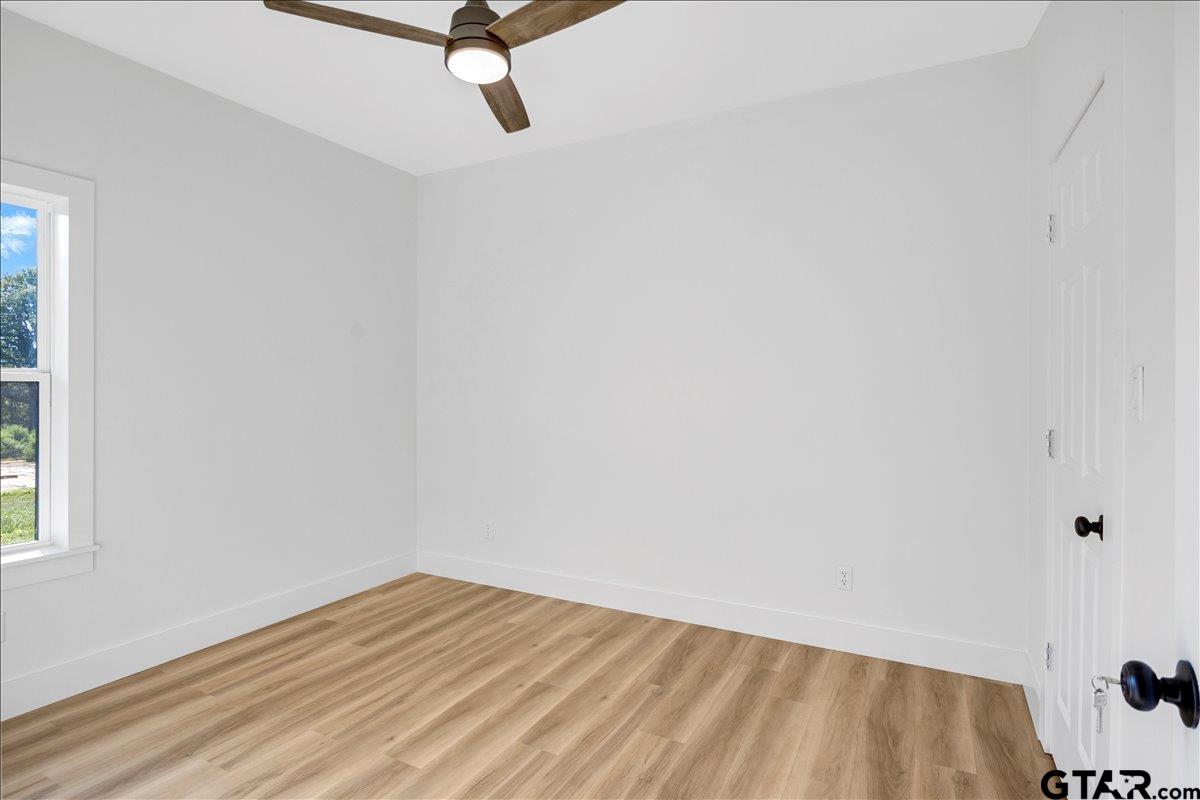 6600 Lionheart Drive Tyler, TX 75708 - Photo 23 of 32 a view of a room with wooden floor and a window