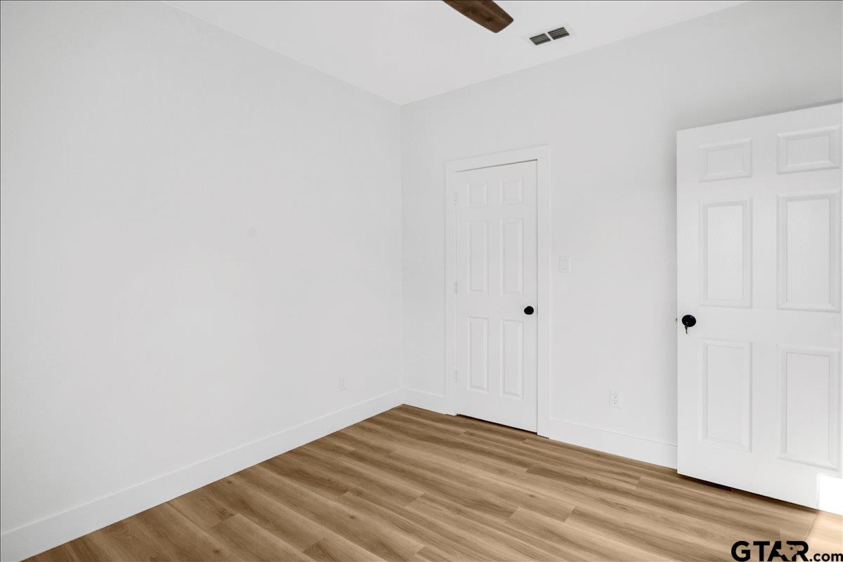 6600 Lionheart Drive Tyler, TX 75708 - Photo 24 of 32 a view of empty room with wooden floor