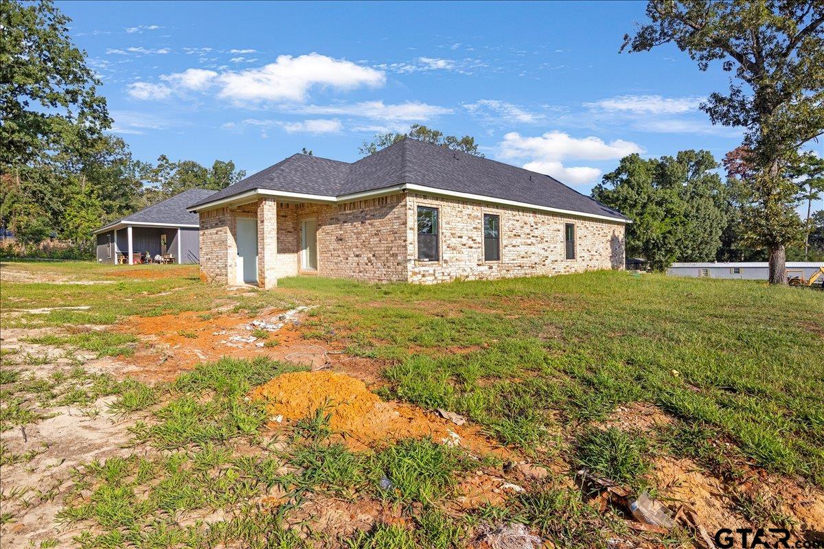 6600 Lionheart Drive Tyler, TX 75708 - Photo 27 of 32 front view of a house with a yard