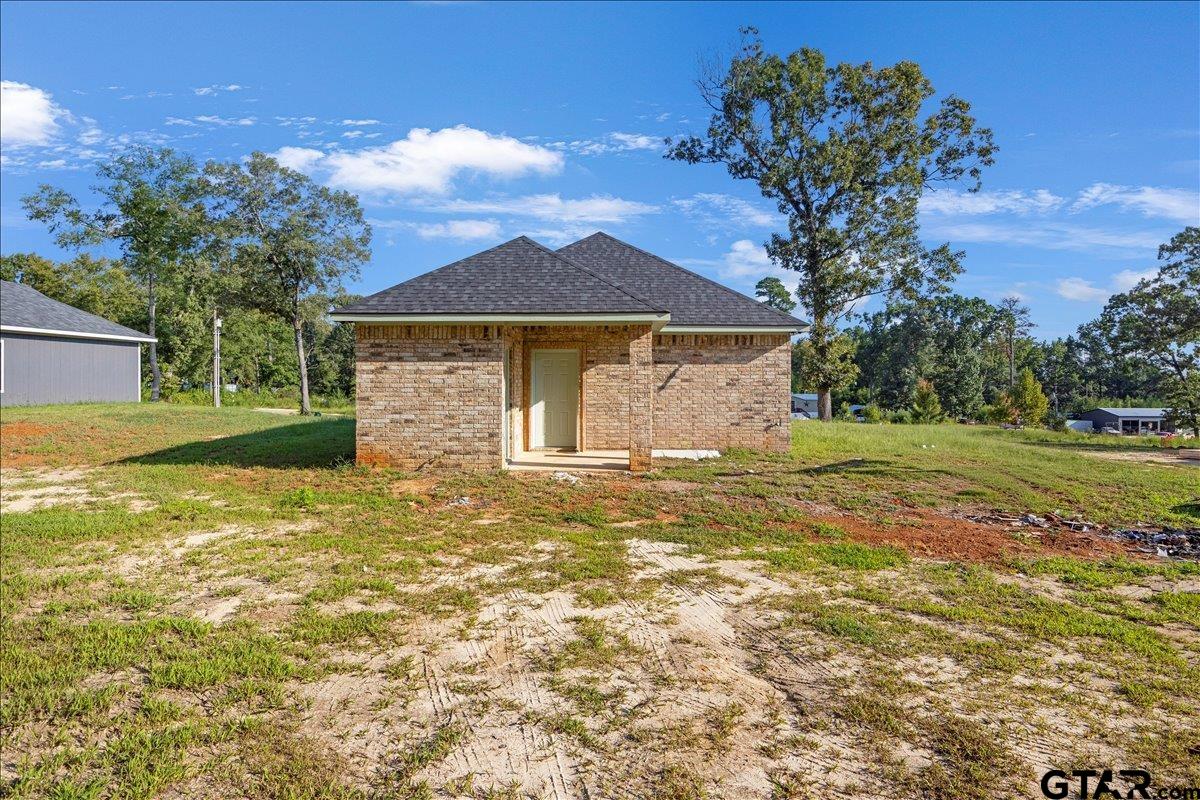 6600 Lionheart Drive Tyler, TX 75708 - Photo 28 of 32 a front view of a house with a garden