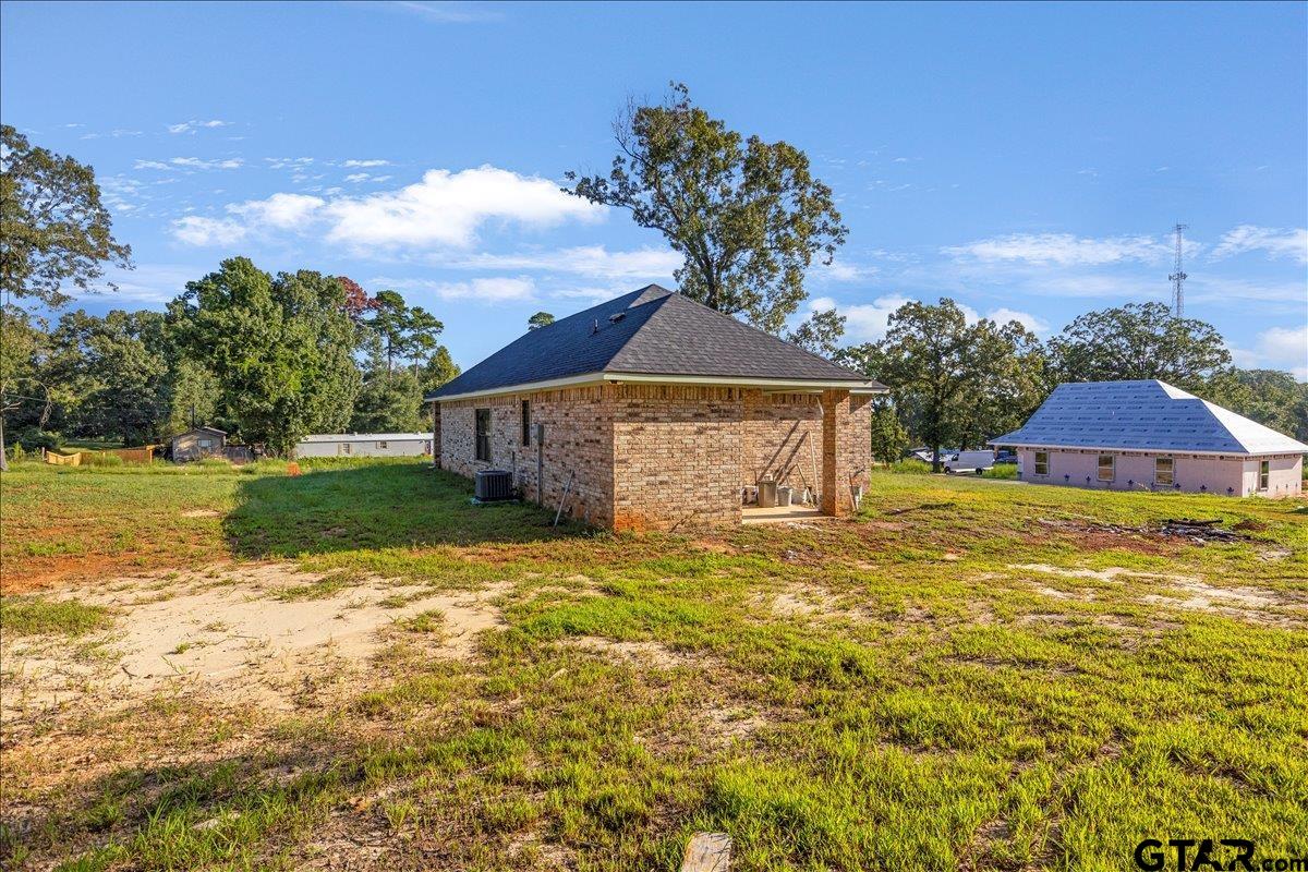 6600 Lionheart Drive Tyler, TX 75708 - Photo 29 of 32 a front view of a house with garden