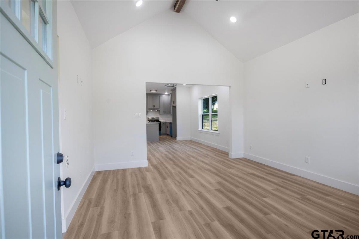 6600 Lionheart Drive Tyler, TX 75708 - Photo 4 of 32 wooden floor in an empty room with a window