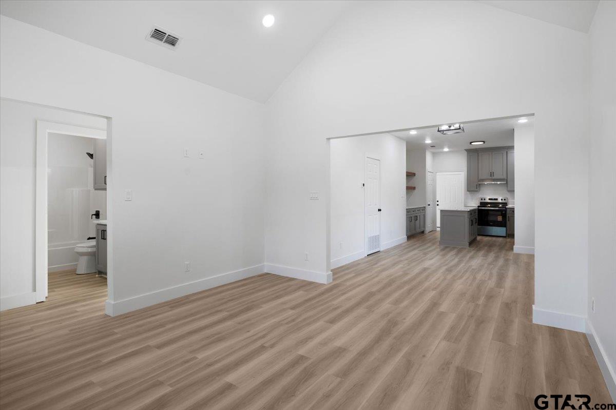 6600 Lionheart Drive Tyler, TX 75708 - Photo 5 of 32 wooden floor in an empty room with a window