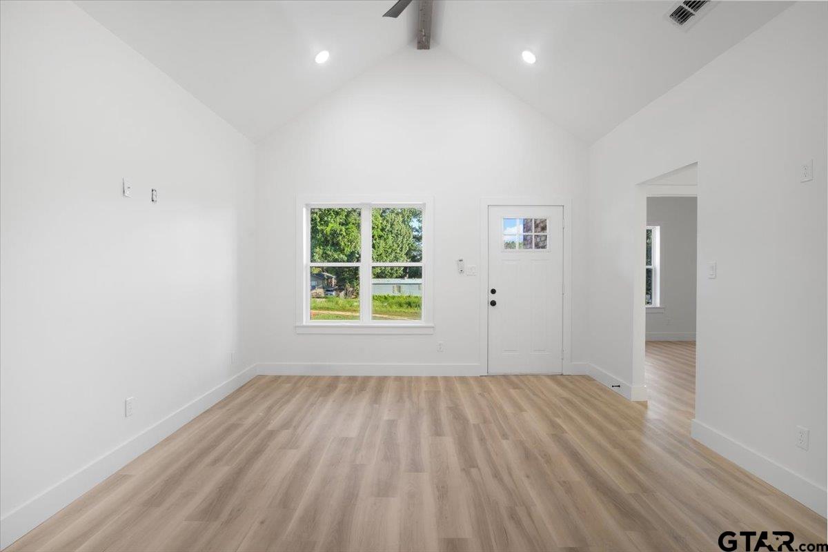 6600 Lionheart Drive Tyler, TX 75708 - Photo 6 of 32 wooden floor in an empty room with a window