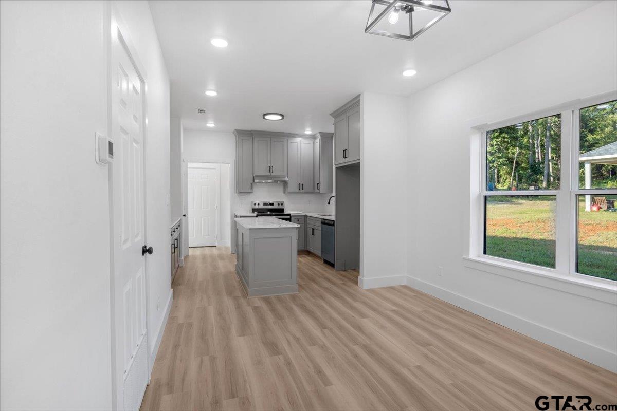 6600 Lionheart Drive Tyler, TX 75708 - Photo 8 of 32 a view of a kitchen with wooden floor and electronic appliances