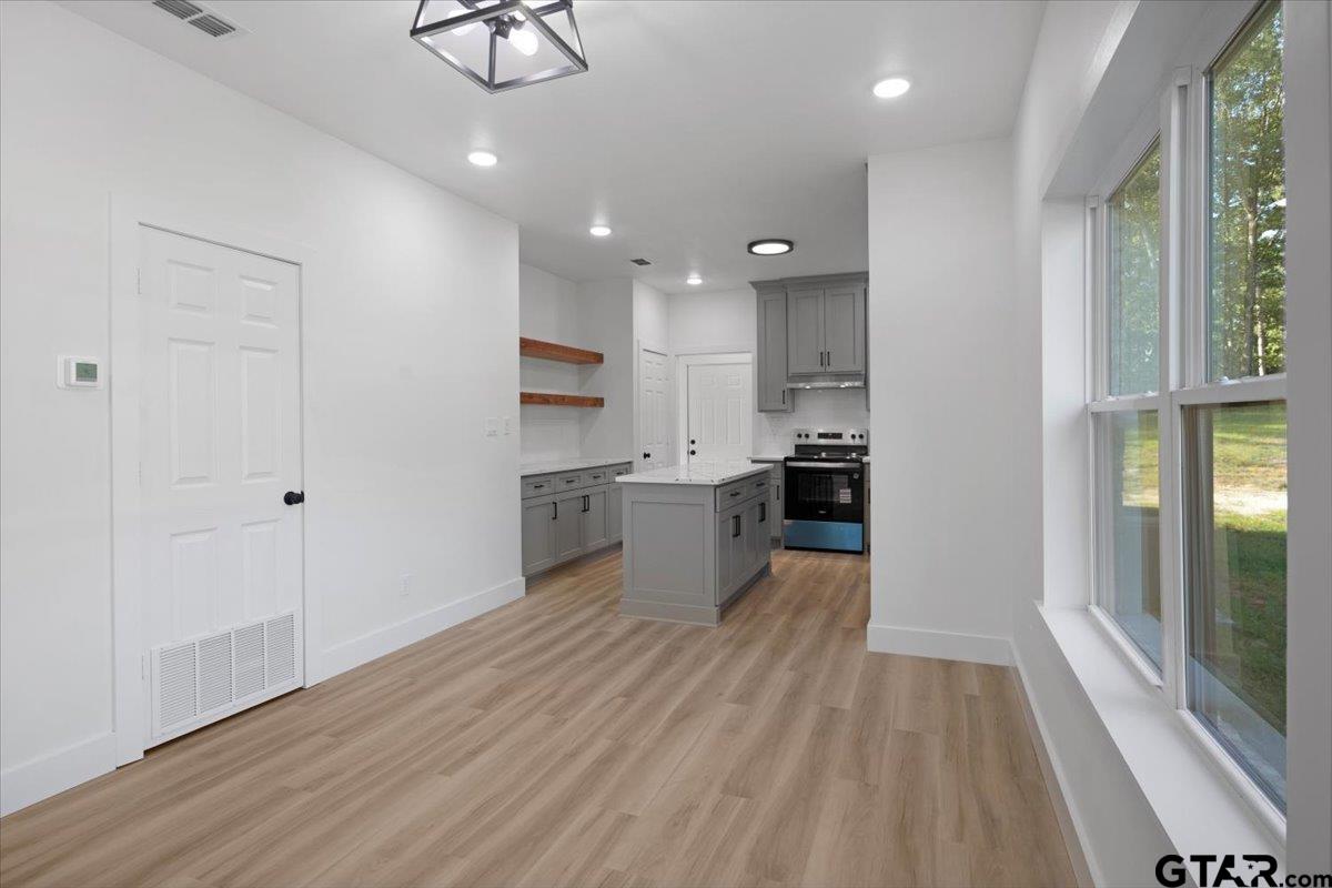 6600 Lionheart Drive Tyler, TX 75708 - Photo 9 of 32 a view of a kitchen with wooden floor and a window