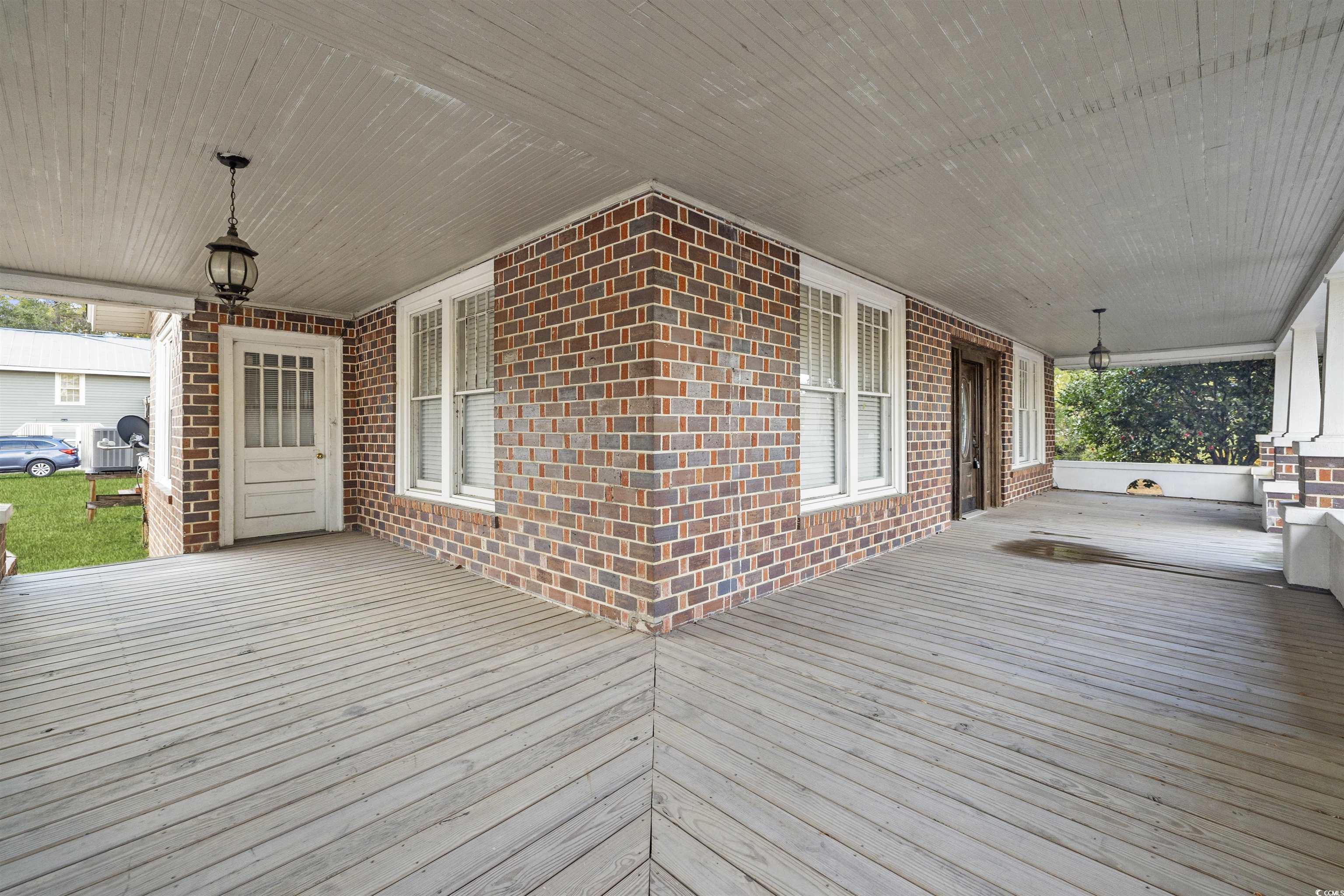 205 South Nichols Street Nichols, SC 29581 - Photo 23 of 27 Wooden deck featuring covered porch