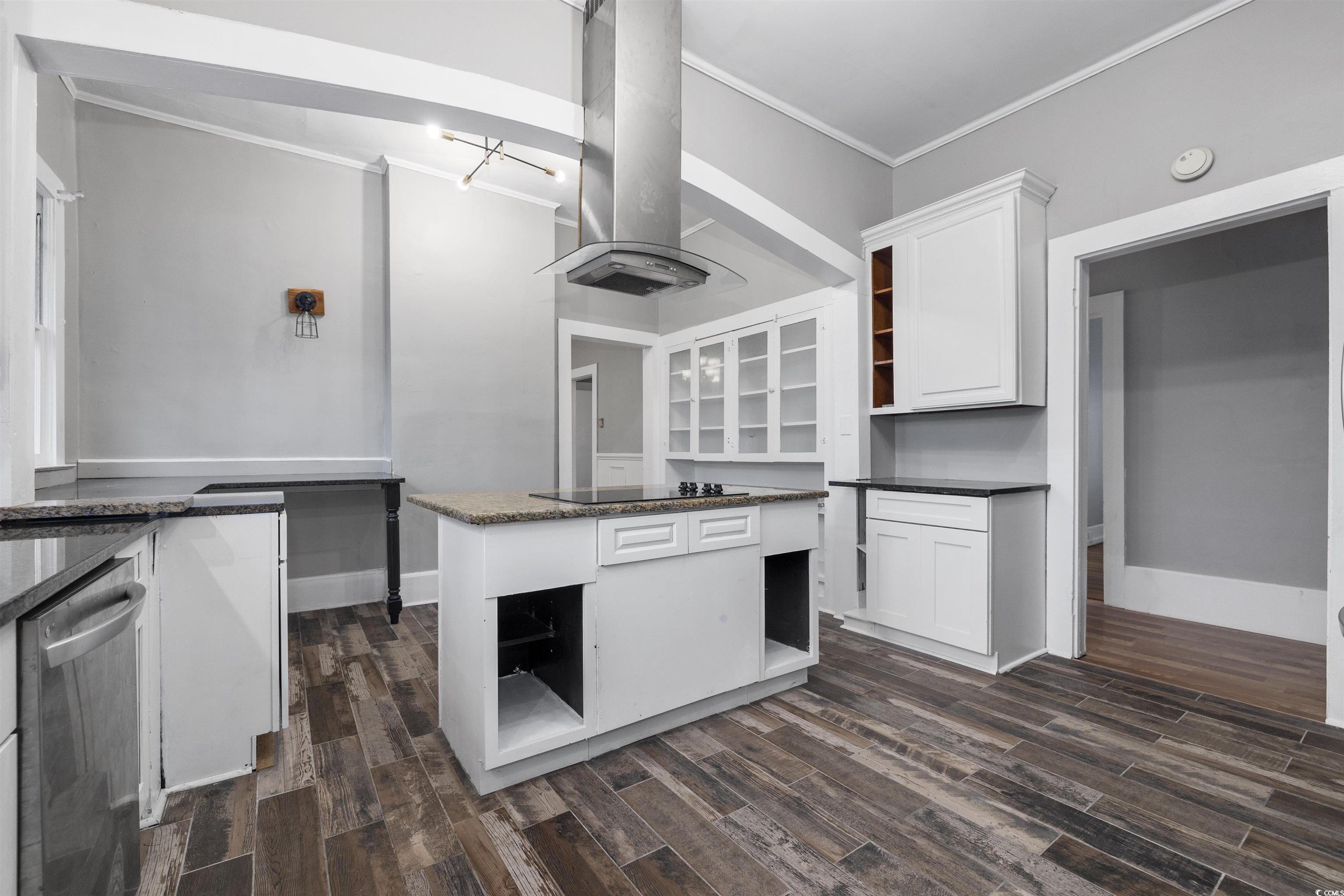 205 South Nichols Street Nichols, SC 29581 - Photo 9 of 27 Kitchen featuring island exhaust hood, dark wood-type flooring, dishwasher, a center island, and white cabinetry