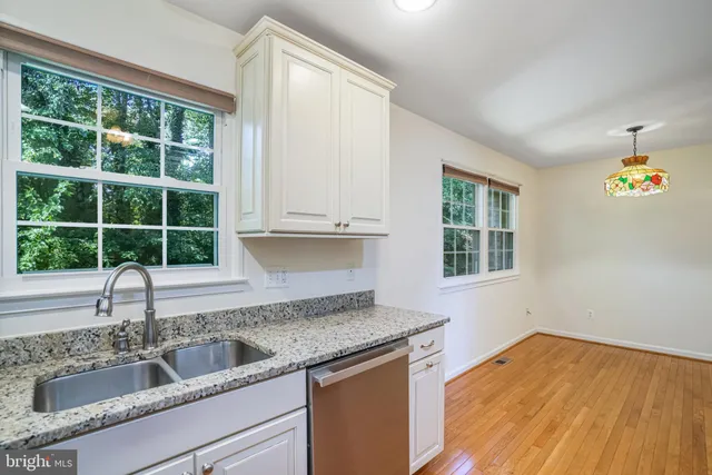 a kitchen with a sink and a window