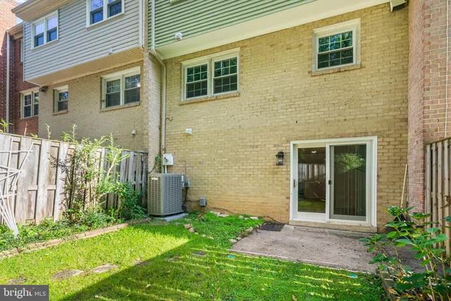 a view of a brick house many windows