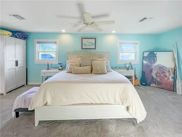 a bedroom with a bed and a walk in closet