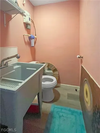 a bathroom with a toilet and a sink
