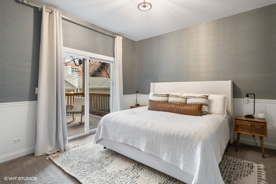 1316 West Fletcher Street, Unit 1E Chicago, IL 60657 - Photo 5 of 13 a bedroom with a bed and a window