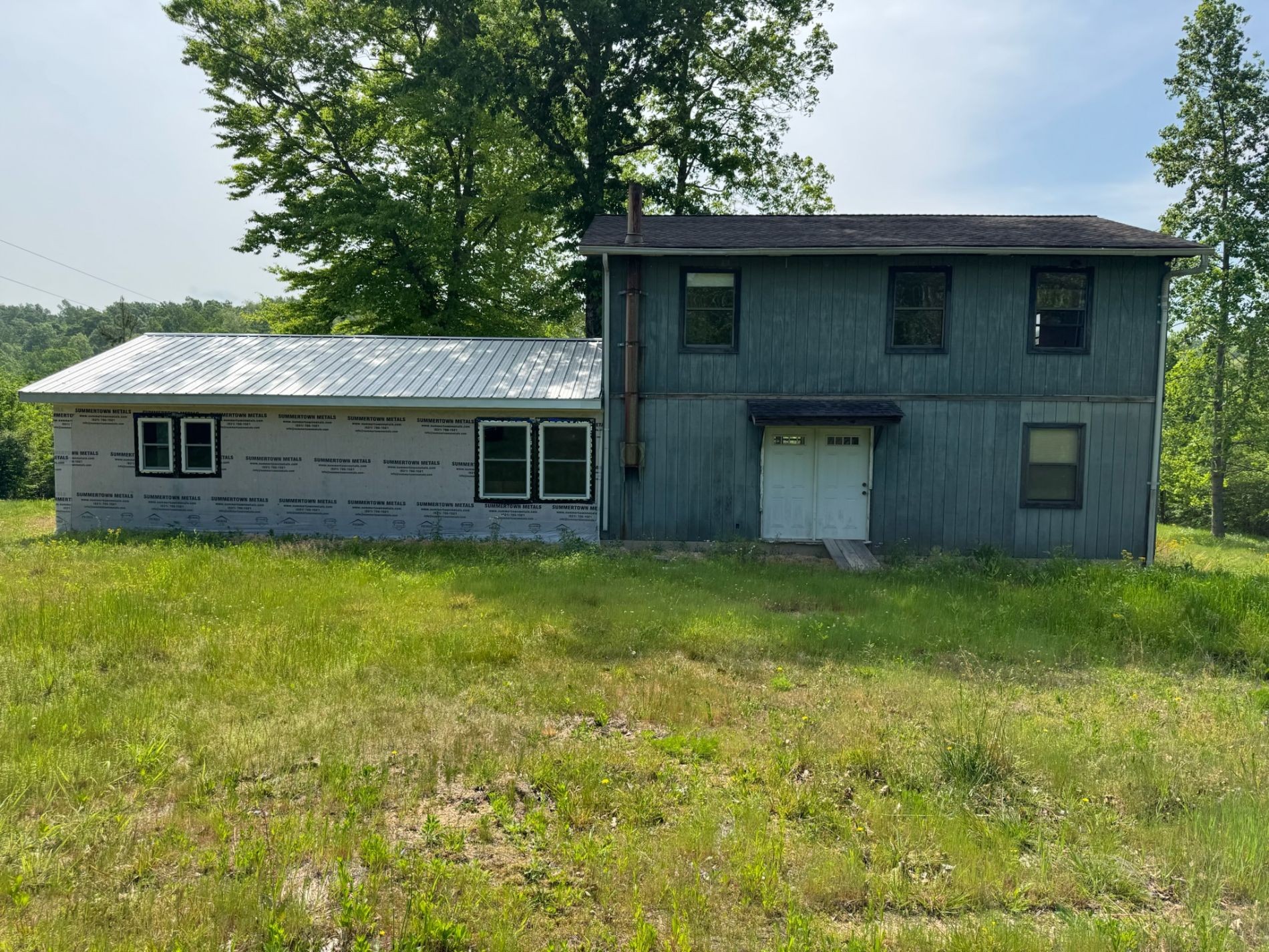465 Zimmerman Road Hampshire, TN 38461 - Photo 1 of 23 a front view of a house with a garden