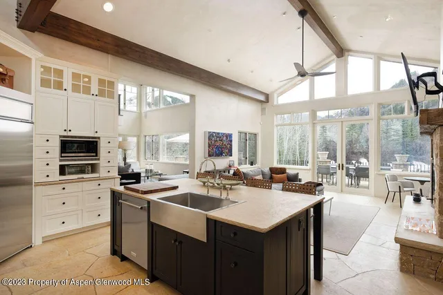 a kitchen with a sink stove and cabinets