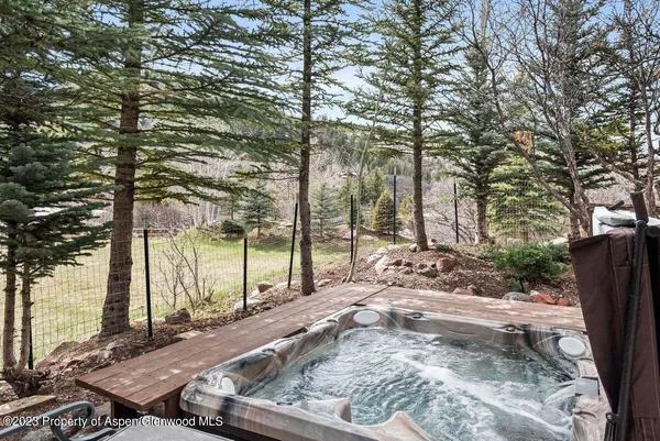 a view of a backyard with sitting area