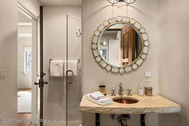 a bathroom with a sink and a mirror