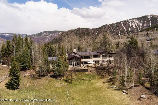 a view of a town with mountains in the background